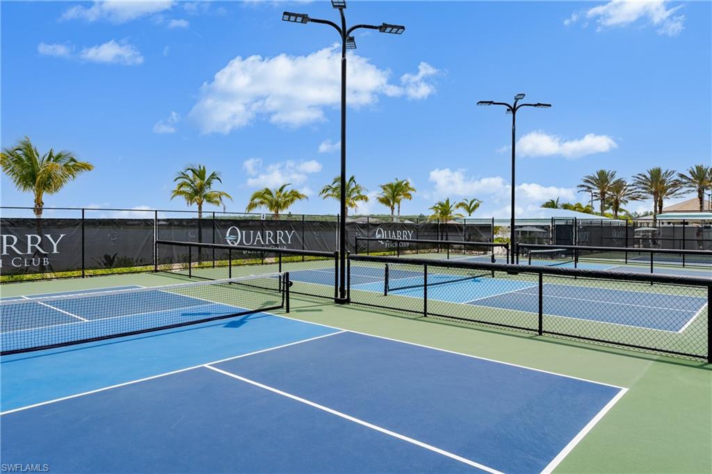 8754 Hideaway Harbor Court Naples, FL 34120 - Photo 39 of 49 a view of a tennis court with tennis court