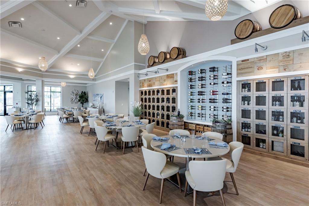 8754 Hideaway Harbor Court Naples, FL 34120 - Photo 41 of 49 a view of a dining room with furniture and wooden floor