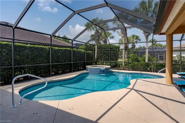 a view of a backyard with sitting area