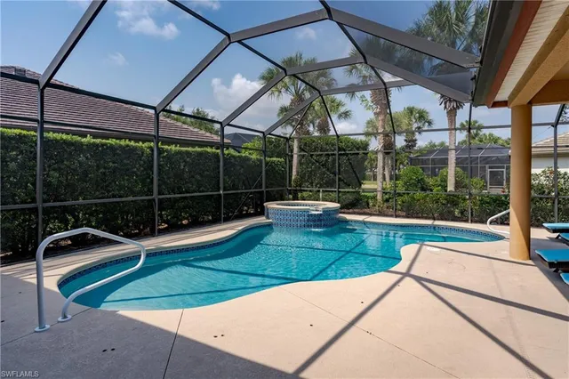 a view of a backyard with sitting area
