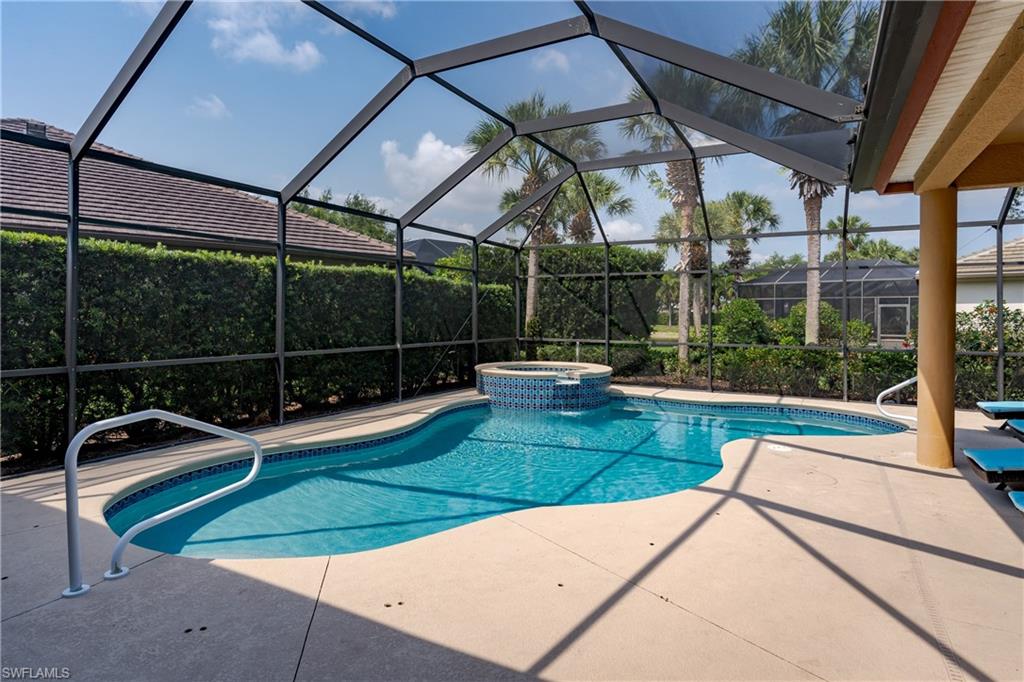 8754 Hideaway Harbor Court Naples, FL 34120 - Photo 6 of 49 a view of a backyard with sitting area