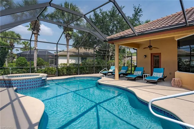 a view of a patio with swimming pool table and chairs
