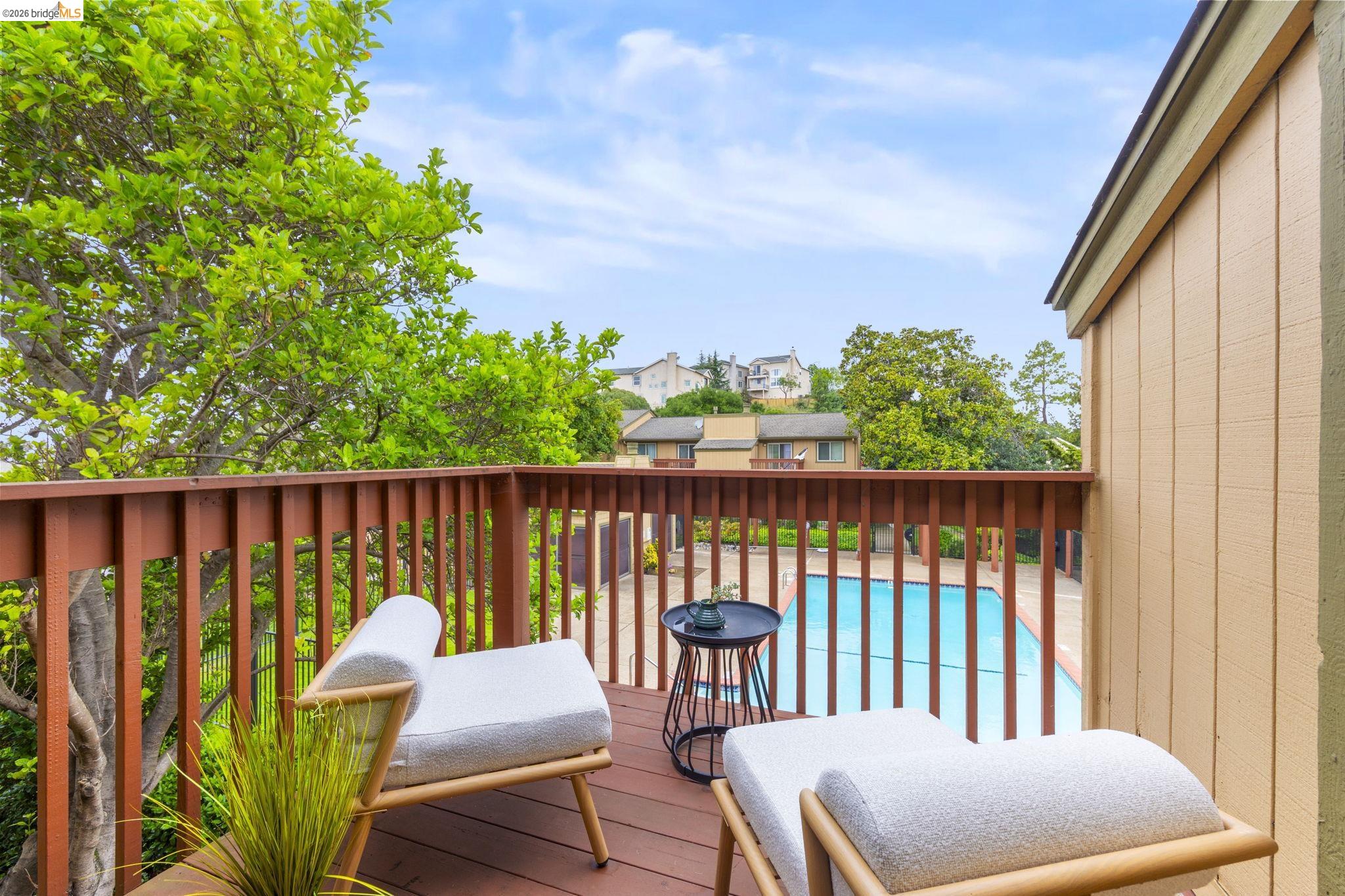 20111 West Ridge Court, Unit 13 Castro Valley, CA 94546 - Photo 1 of 50 Wooden deck with a community pool