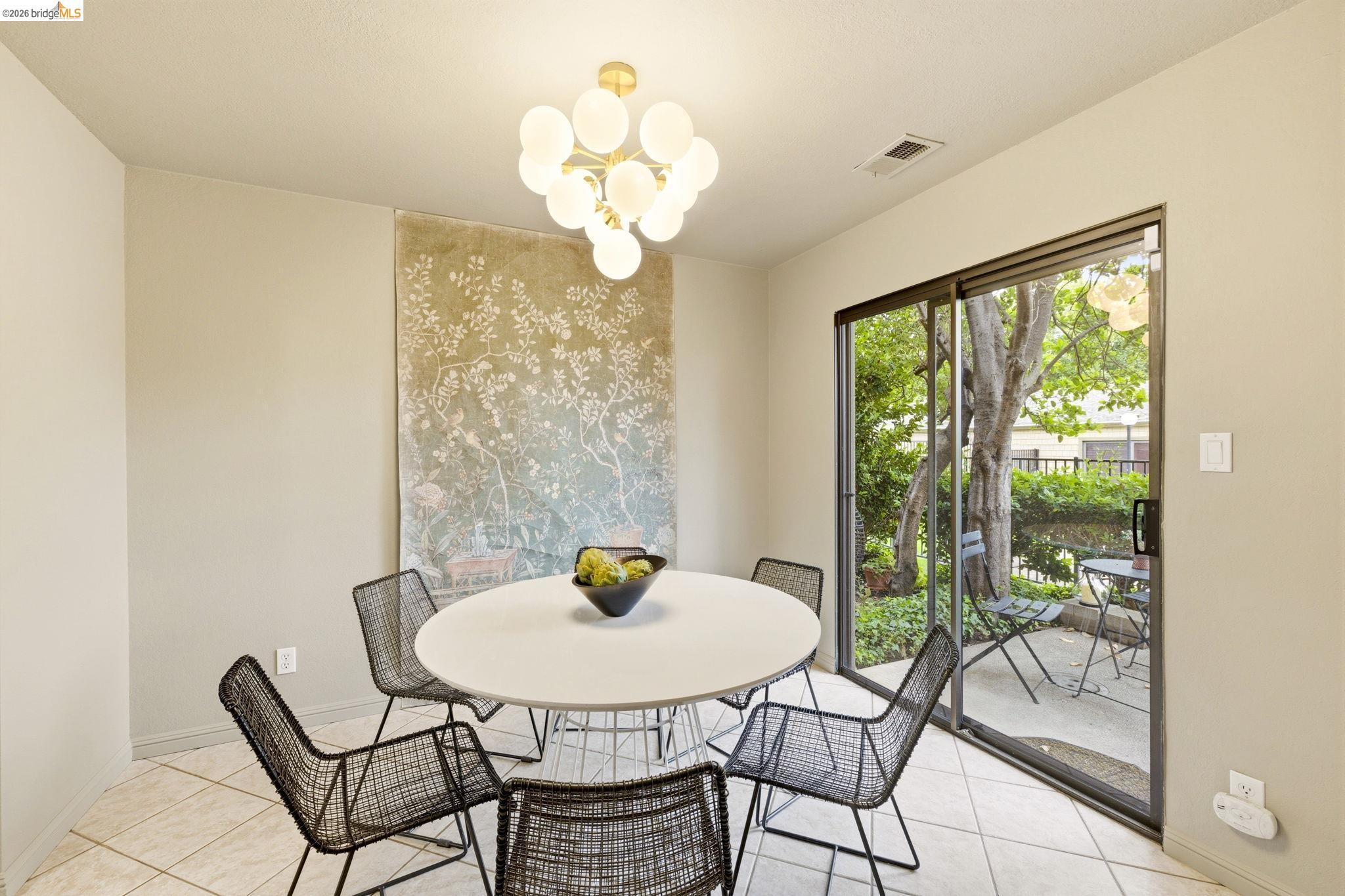 20111 West Ridge Court, Unit 13 Castro Valley, CA 94546 - Photo 14 of 50 Dining area with light tile patterned floors and hanging lights