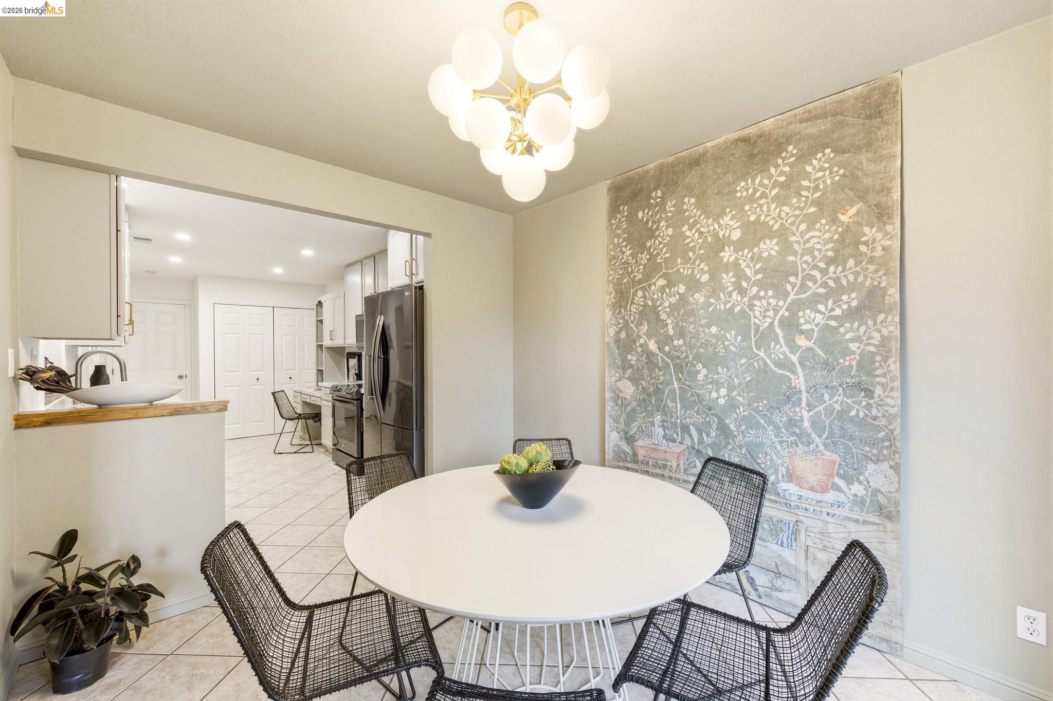 20111 West Ridge Court, Unit 13 Castro Valley, CA 94546 - Photo 15 of 50 Dining space featuring light tile patterned flooring and suspended lighting