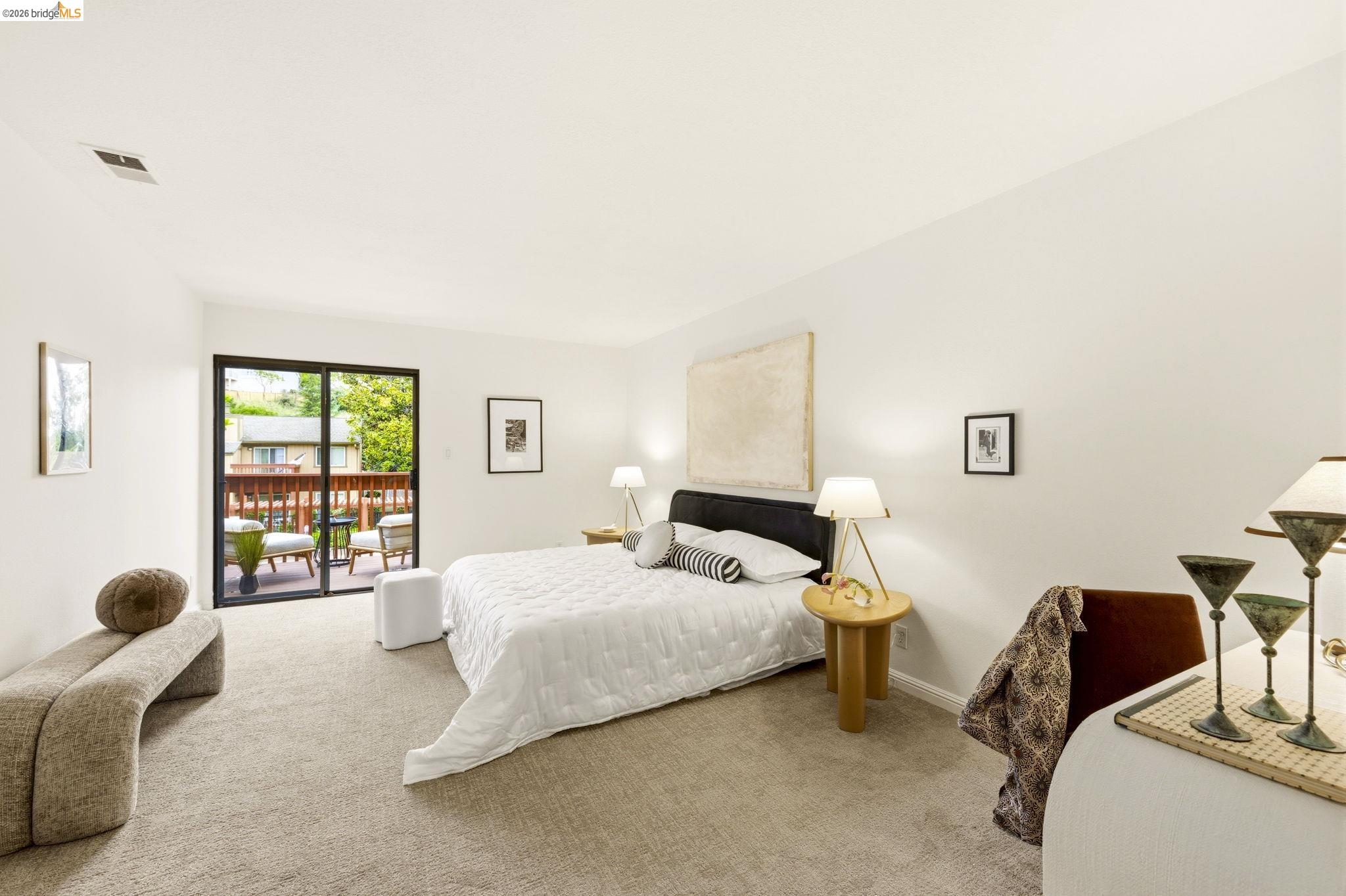 20111 West Ridge Court, Unit 13 Castro Valley, CA 94546 - Photo 31 of 50 Carpeted bedroom with access to outside and baseboards