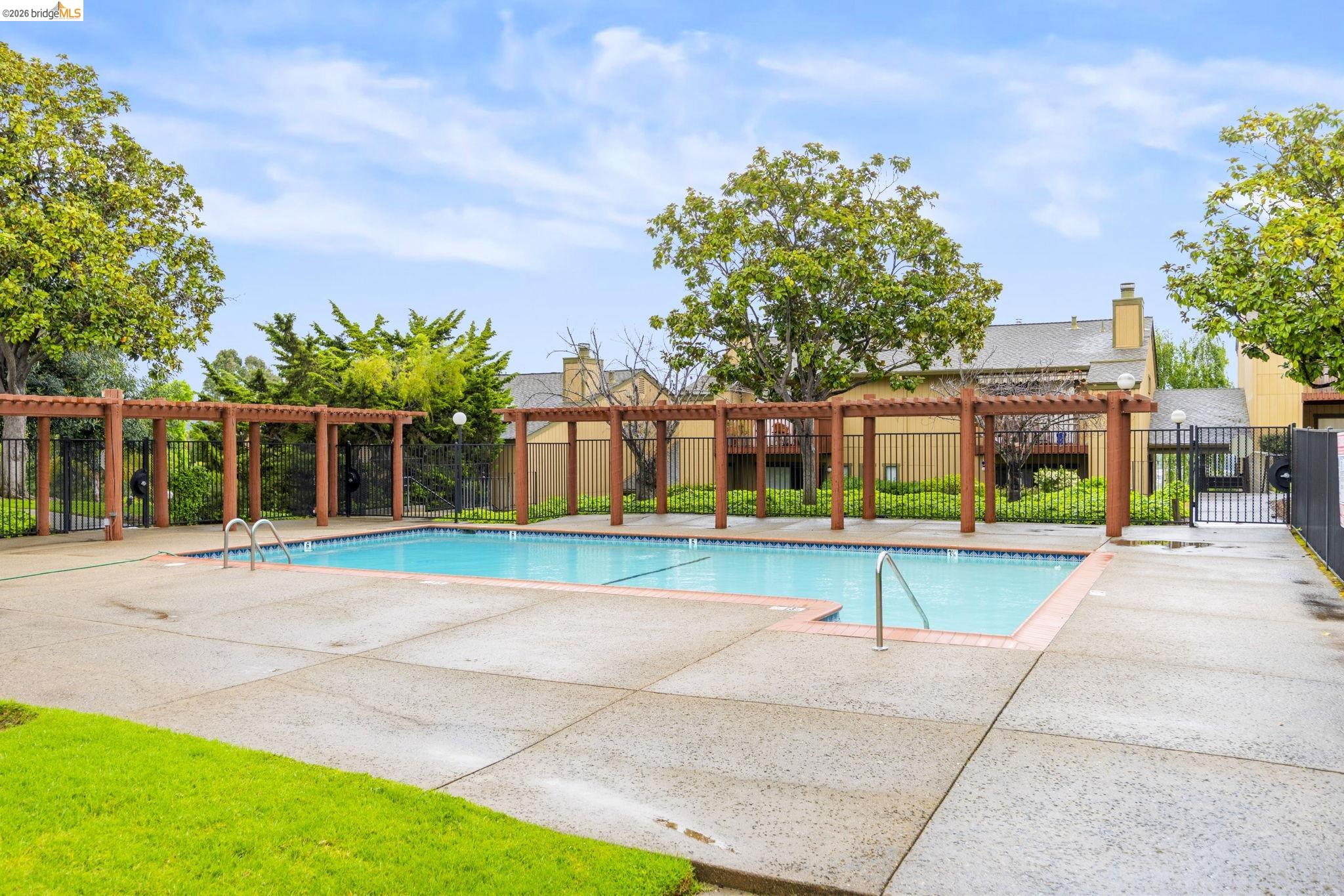 20111 West Ridge Court, Unit 13 Castro Valley, CA 94546 - Photo 39 of 50 Community pool featuring a pergola and a patio area
