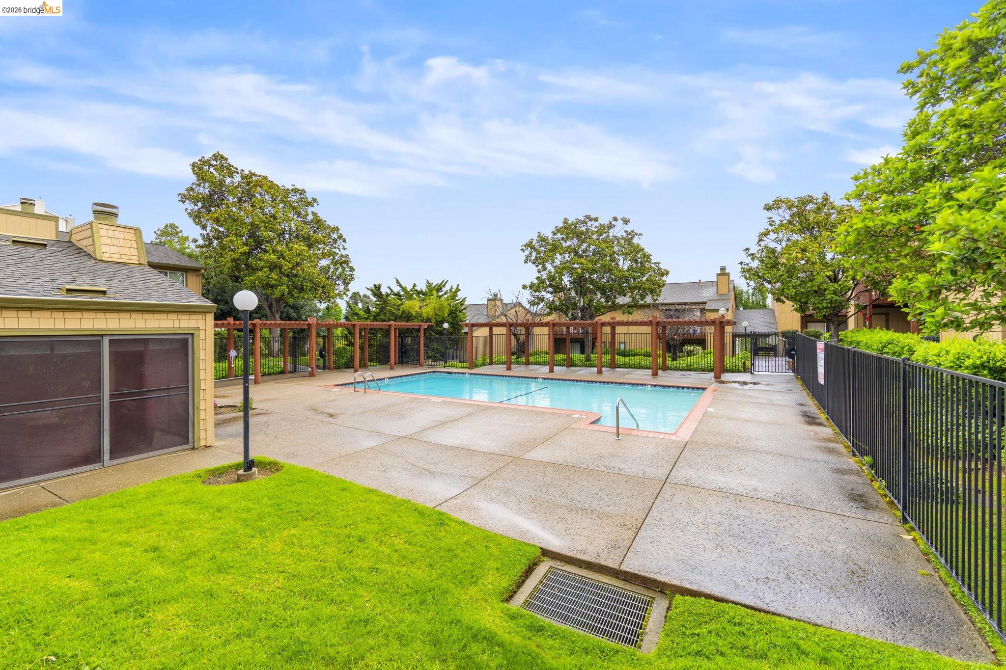 20111 West Ridge Court, Unit 13 Castro Valley, CA 94546 - Photo 40 of 50 Community pool featuring a patio area and a pergola