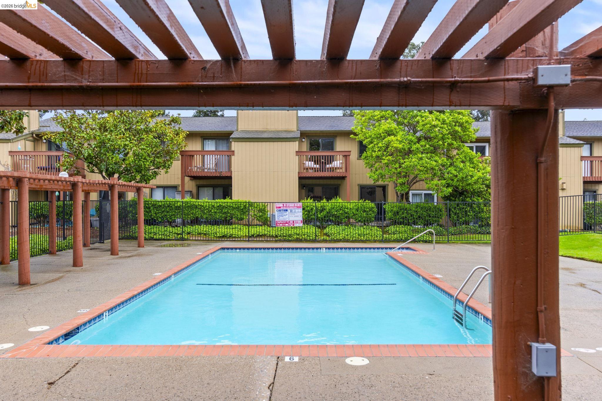 20111 West Ridge Court, Unit 13 Castro Valley, CA 94546 - Photo 41 of 50 Community pool with a pergola and a patio area
