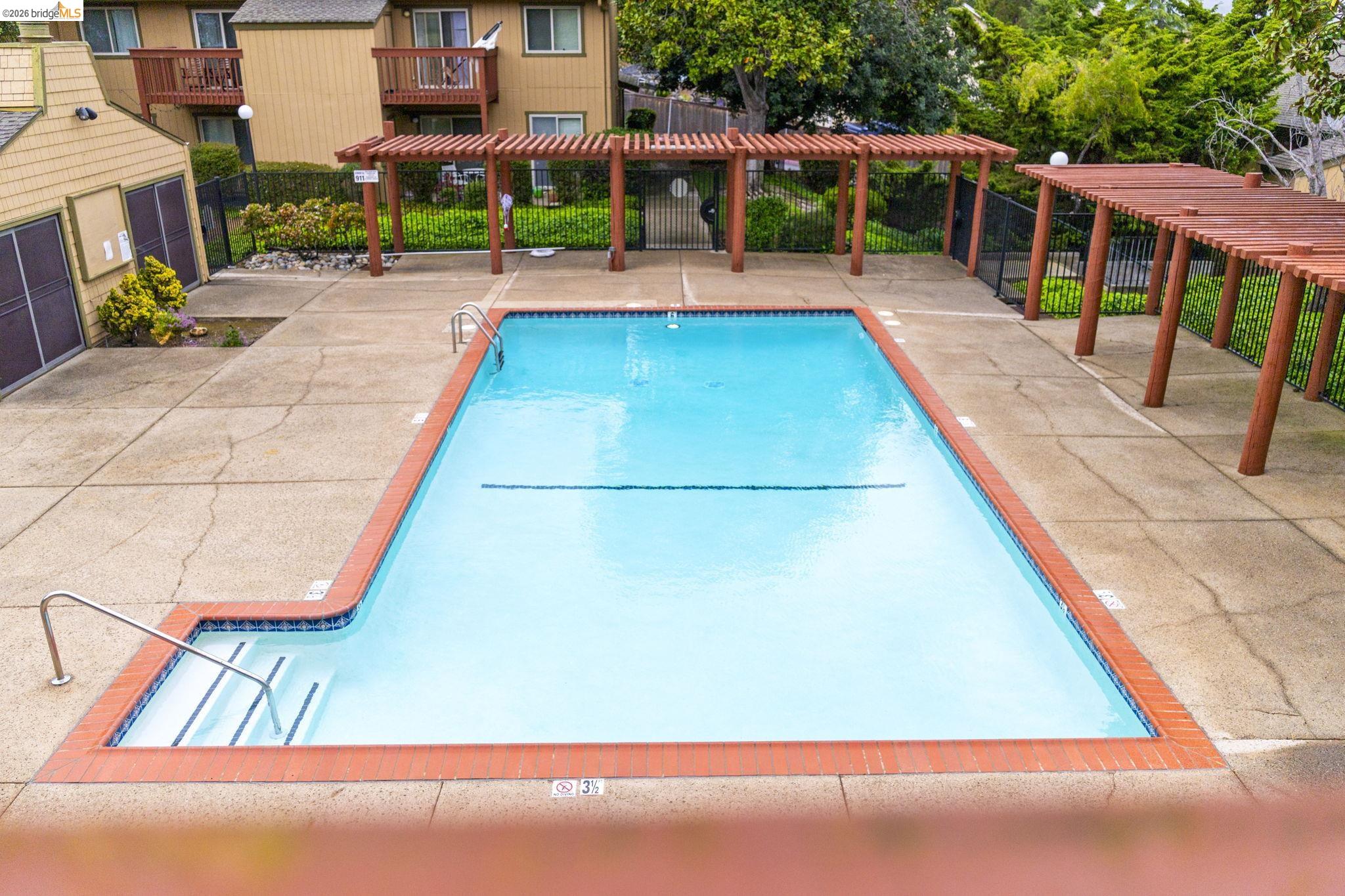 20111 West Ridge Court, Unit 13 Castro Valley, CA 94546 - Photo 43 of 50 Community pool with a pergola and a patio