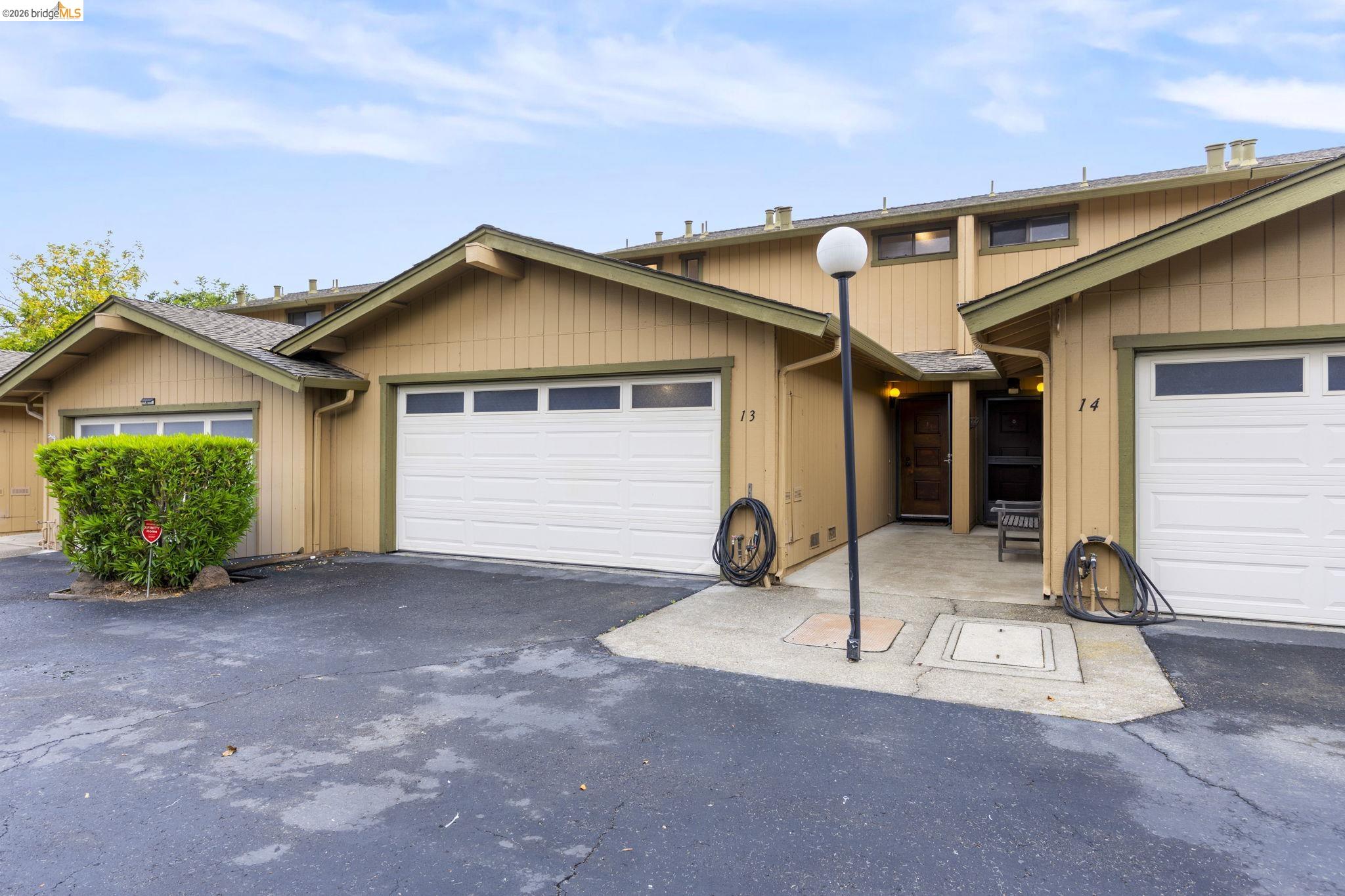 20111 West Ridge Court, Unit 13 Castro Valley, CA 94546 - Photo 45 of 50 View of front of house with asphalt driveway