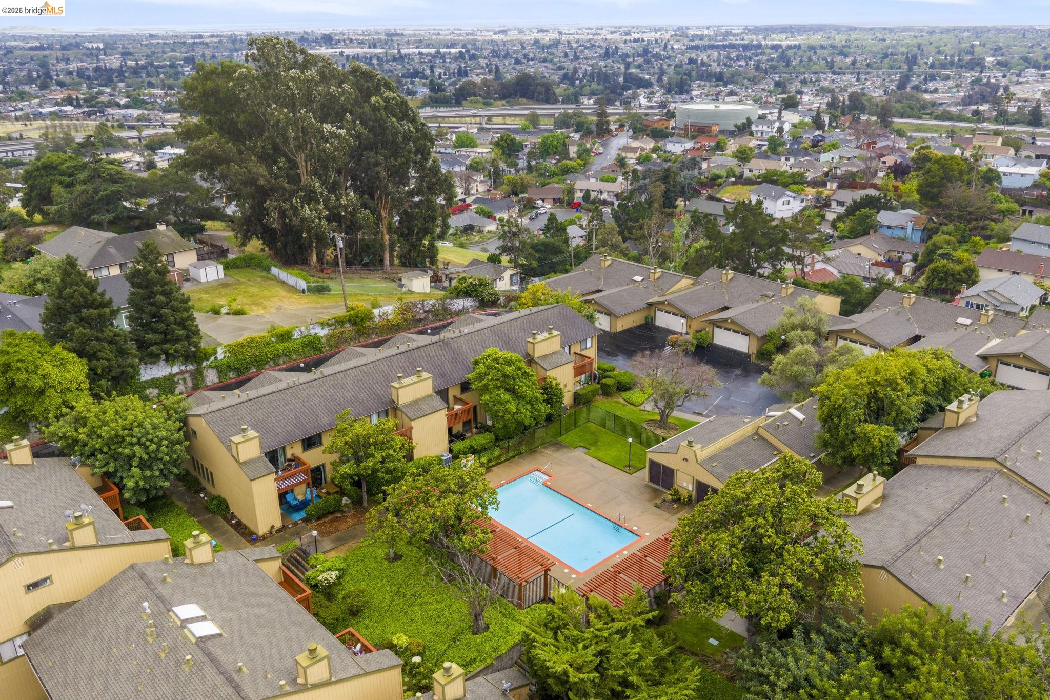 20111 West Ridge Court, Unit 13 Castro Valley, CA 94546 - Photo 48 of 50 Aerial view of residential area featuring a pool area