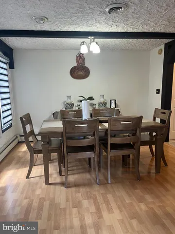 a view of a dining room with furniture