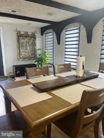 a kitchen with a table and chairs in it