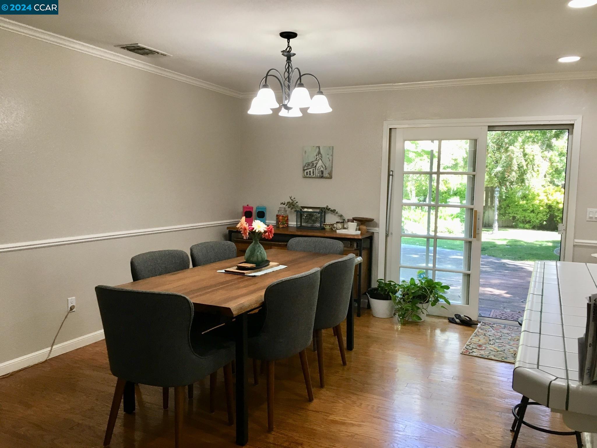 1317 David Lane Concord, CA 94518 - Photo 3 of 16 a view of a dining room with furniture window and wooden floor