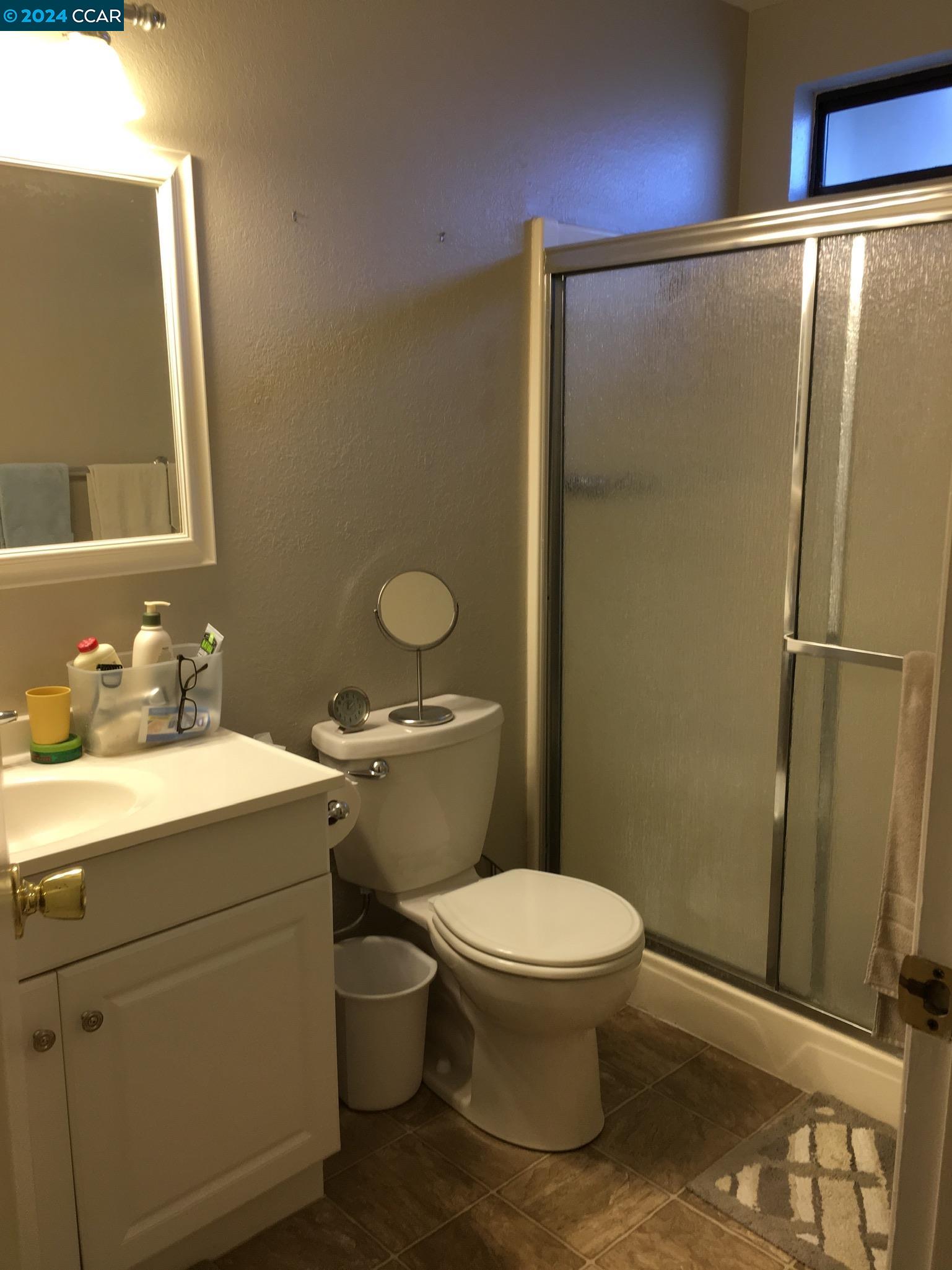 1317 David Lane Concord, CA 94518 - Photo 6 of 16 a bathroom with a granite countertop sink toilet and shower