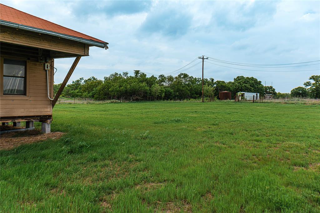 183 Rising Star Tx 76471 Rising Star, TX 76471 - Photo 11 of 19 a view of a wooden deck and a yard