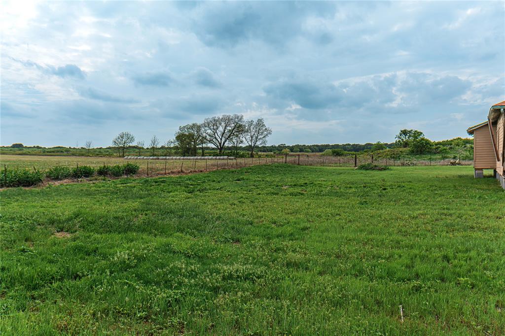183 Rising Star Tx 76471 Rising Star, TX 76471 - Photo 2 of 19 a view of a green field