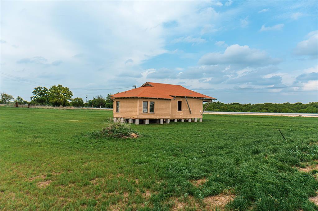 183 Rising Star Tx 76471 Rising Star, TX 76471 - Photo 5 of 19 a backyard of a house with lots of green space and garden