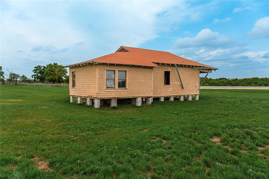 183 Rising Star Tx 76471 Rising Star, TX 76471 - Photo 7 of 19 a view of a house with a yard