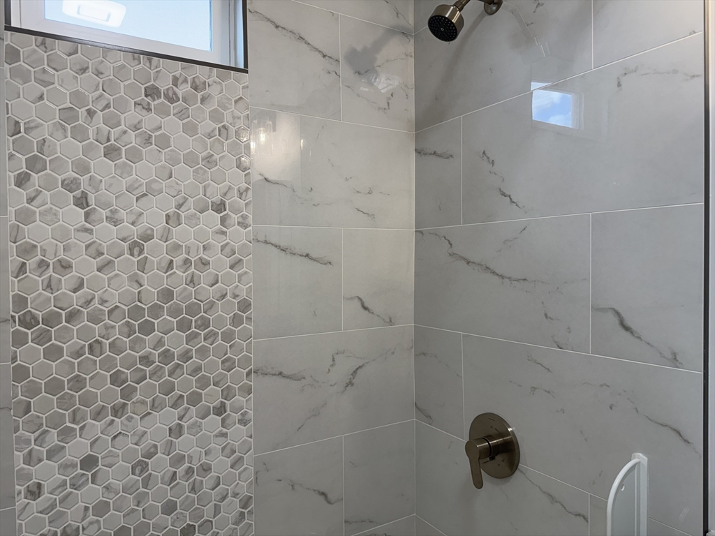 630 Metropolitan Avenue, Unit 3 Boston, MA 02136 - Photo 11 of 31 a bathroom with a shower