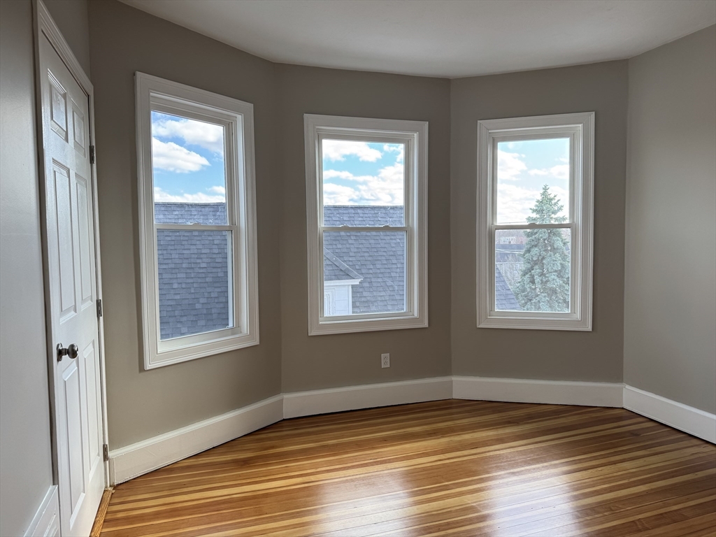 630 Metropolitan Avenue, Unit 3 Boston, MA 02136 - Photo 14 of 31 a view of an empty room and window