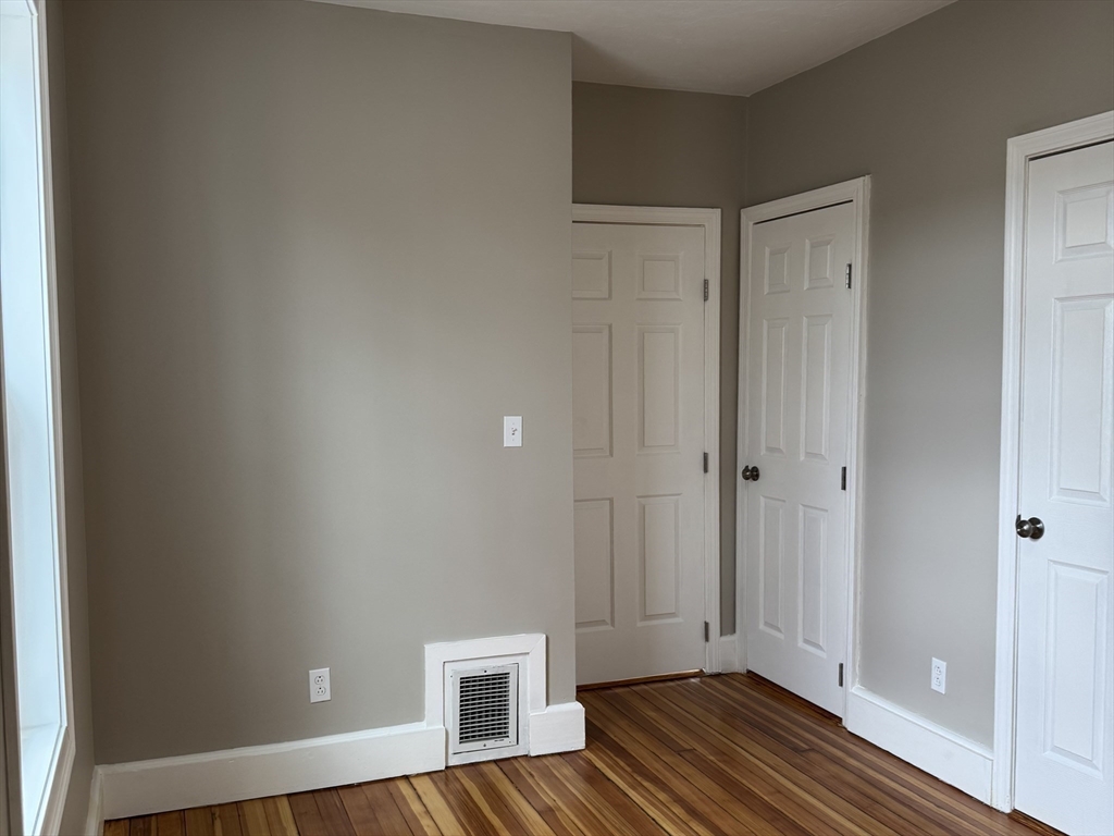 630 Metropolitan Avenue, Unit 3 Boston, MA 02136 - Photo 19 of 31 a view of a livingroom with wooden floor