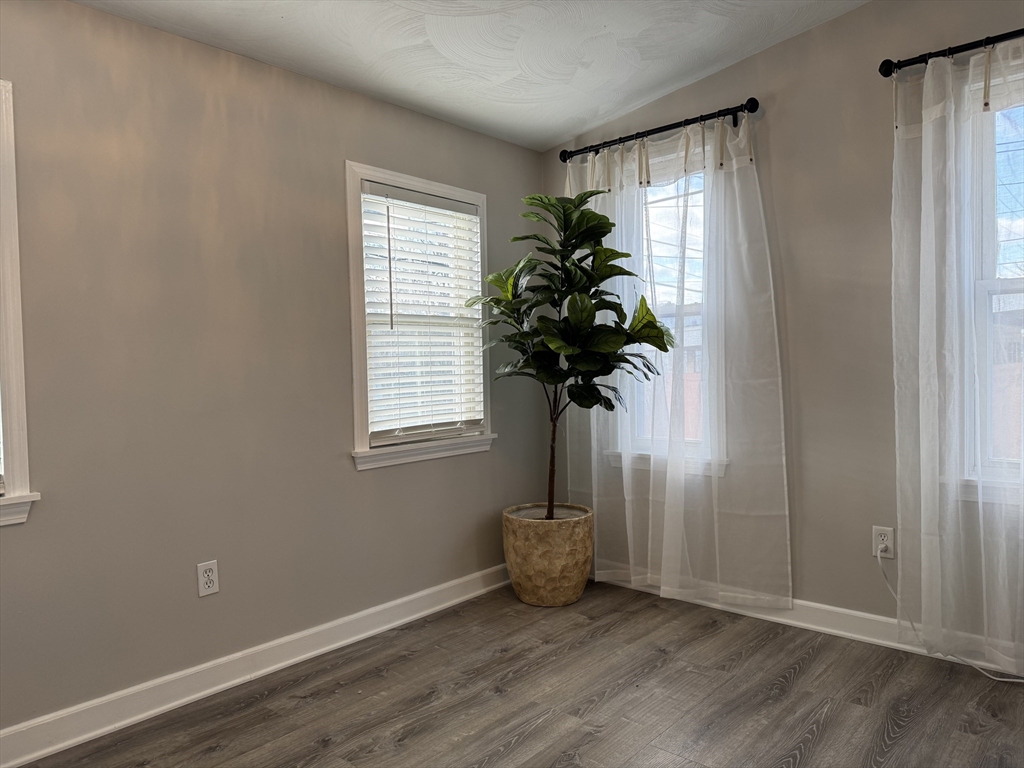 630 Metropolitan Avenue, Unit 3 Boston, MA 02136 - Photo 30 of 31 a view of entryway with window and wooden floor