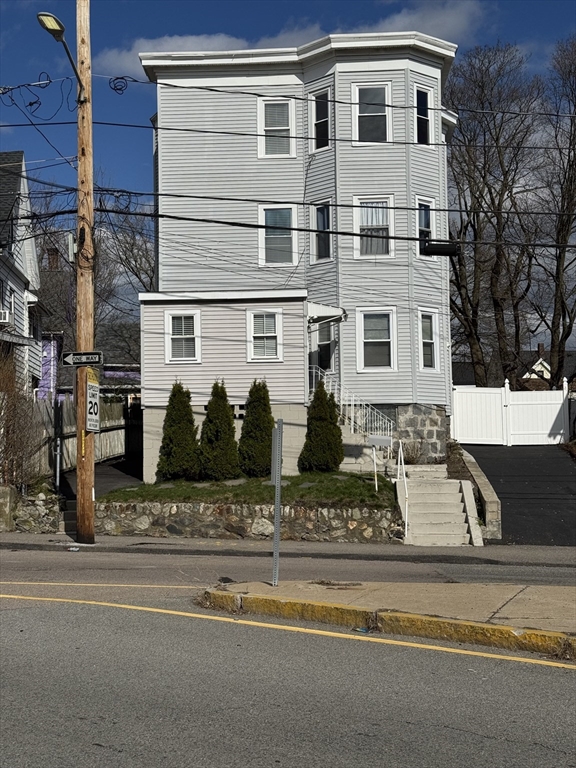 630 Metropolitan Avenue, Unit 3 Boston, MA 02136 - Photo 31 of 31 a front view of a house with garden