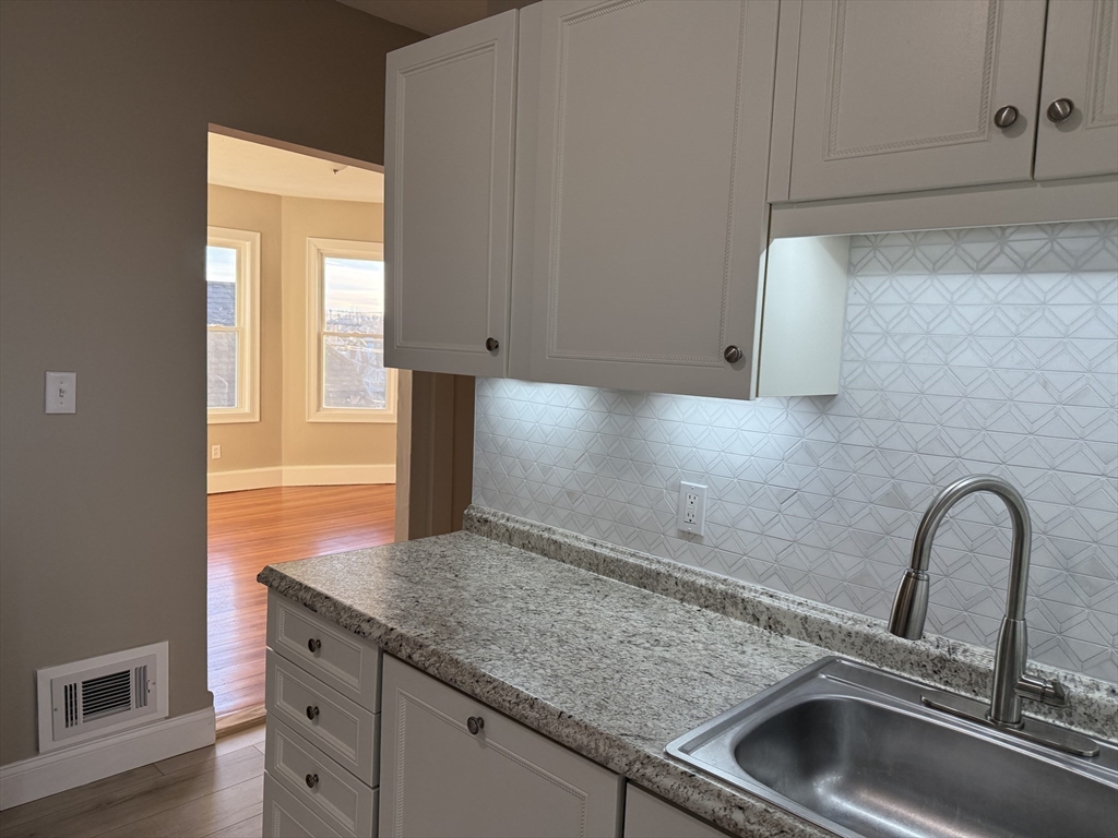 630 Metropolitan Avenue, Unit 3 Boston, MA 02136 - Photo 5 of 31 a close view of sink and tap