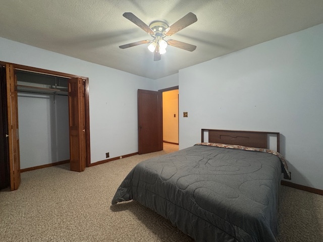307 North Linden Street Clinton, IL 61727 - Photo 28 of 50 a bedroom with a bed and a ceiling fan