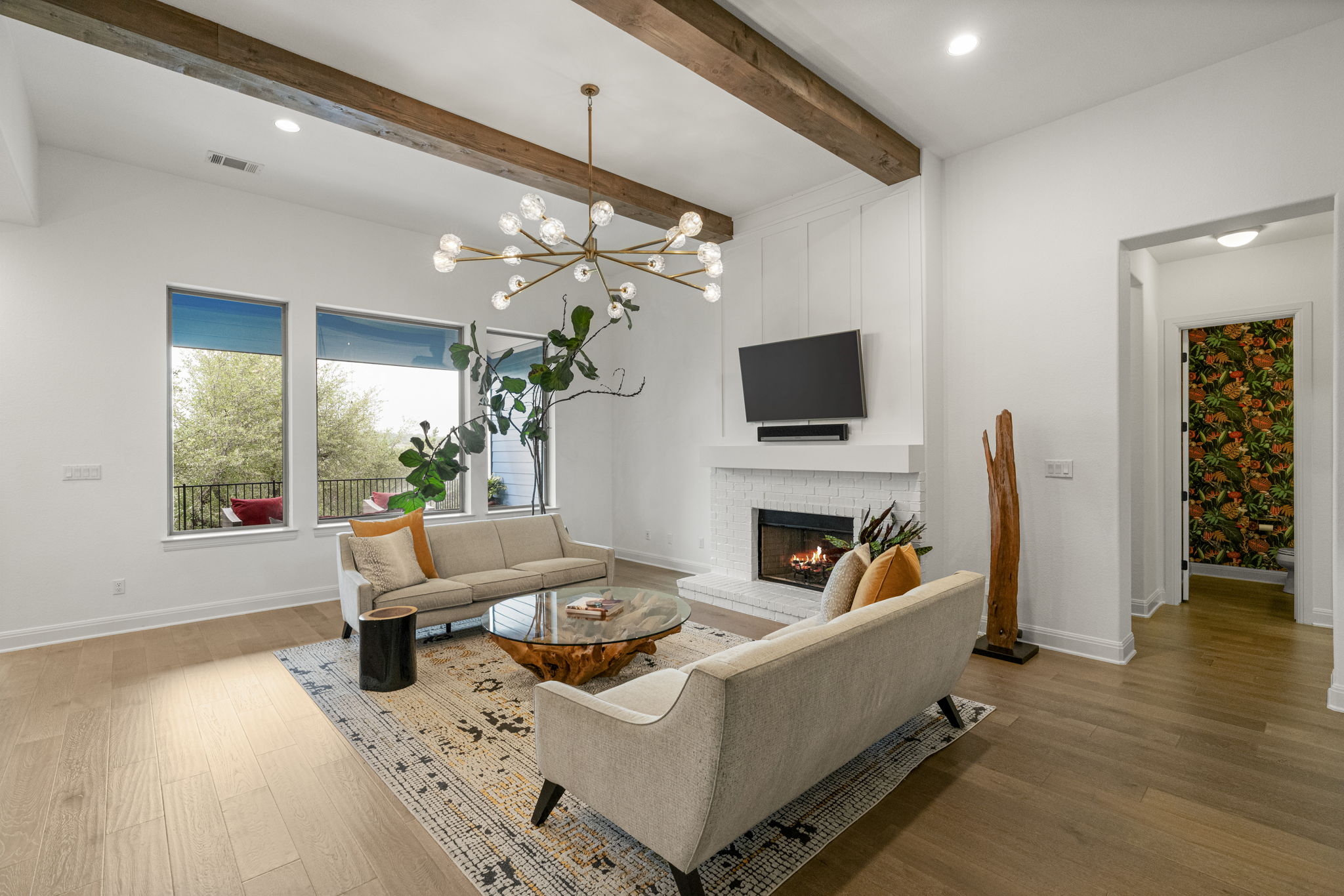 288 Hazy Hills Loop Dripping Springs, TX 78620 - Photo 13 of 40 An open-concept living space designed for comfort and boasting beamed ceilings.