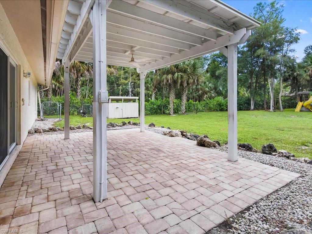 4220 11th Avenue Southwest Naples, FL 34116 - Photo 18 of 25 a view of a house with backyard and porch
