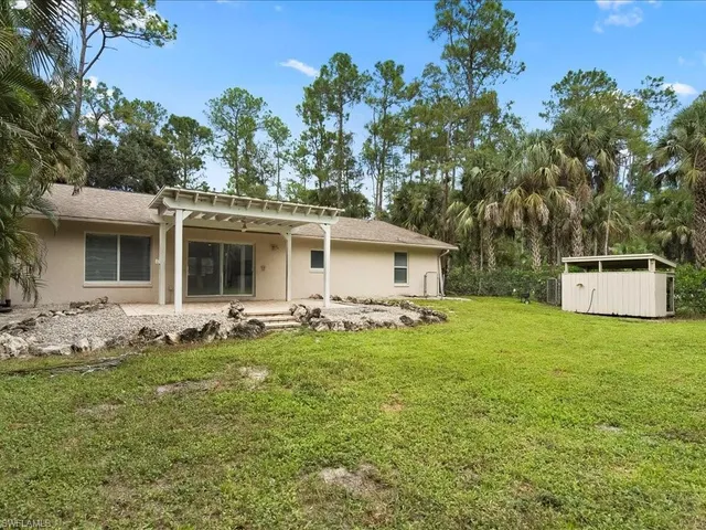 a front view of house with yard and seating area