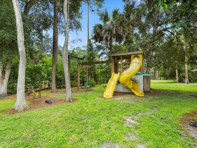 a view of a park with a slide