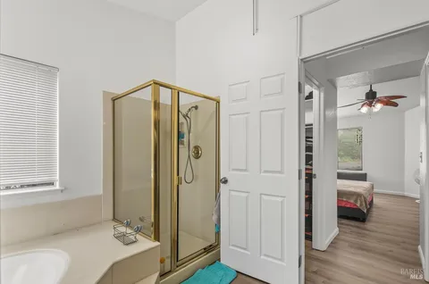 a bathroom with a shower and a sink