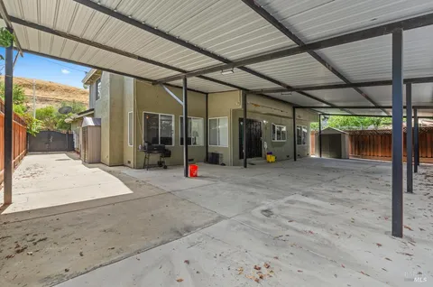 an aerial view of multiple houses with yard