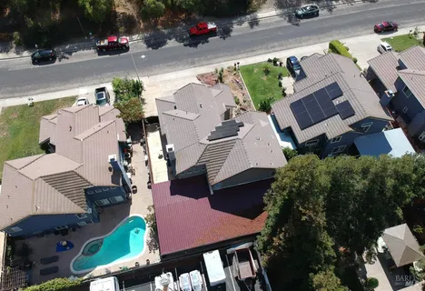 an aerial view of house with yard