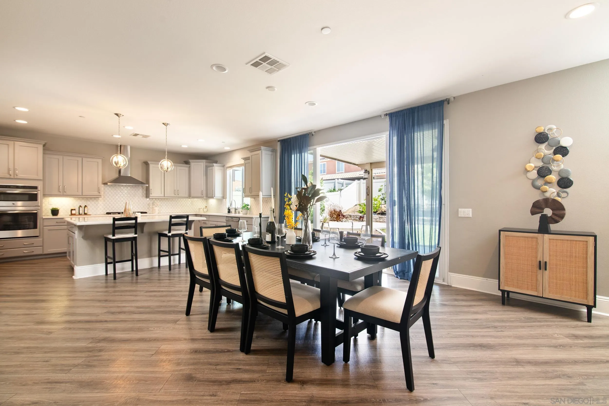 a view of a dining room with furniture and wooden floor