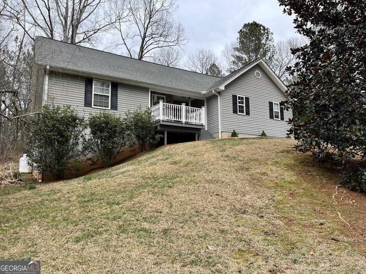193 Old Cherokee Road Cleveland, GA 30528 - Photo 1 of 1 a view of a house with a yard and potted plants
