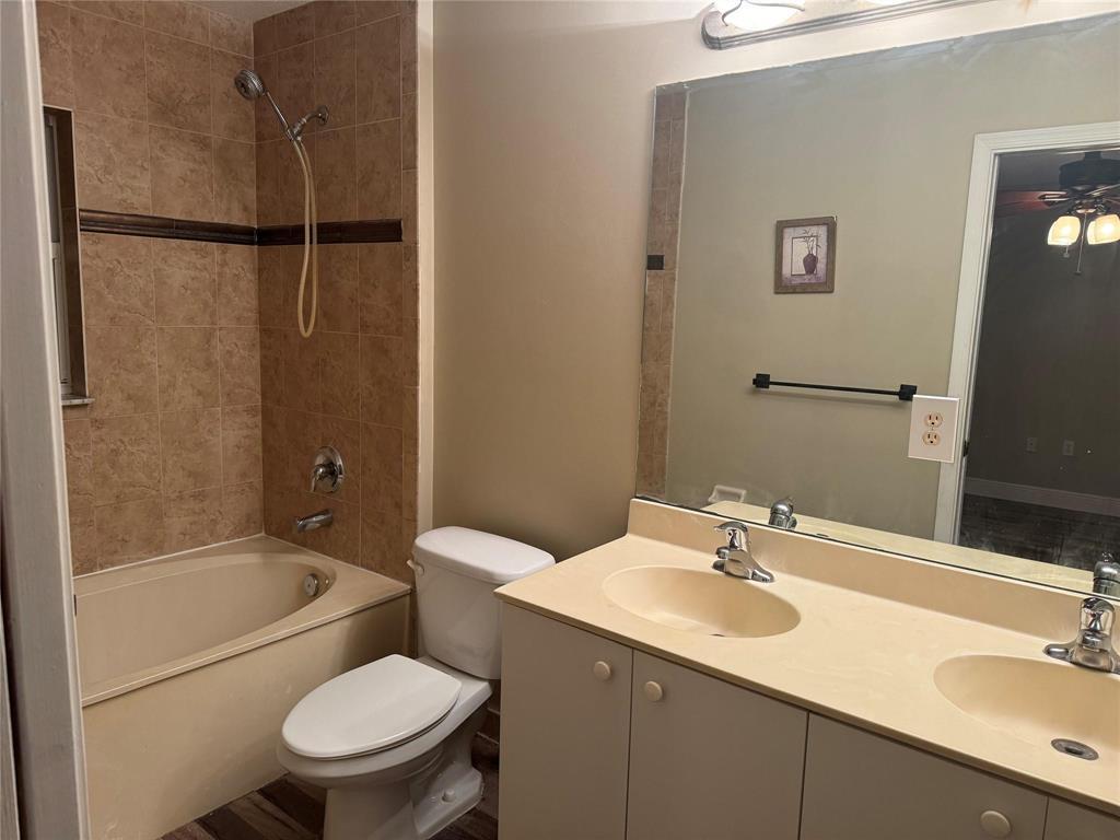 6351 Landings Way Tamarac, FL 33321 - Photo 13 of 16 a bathroom with a sink toilet and shower