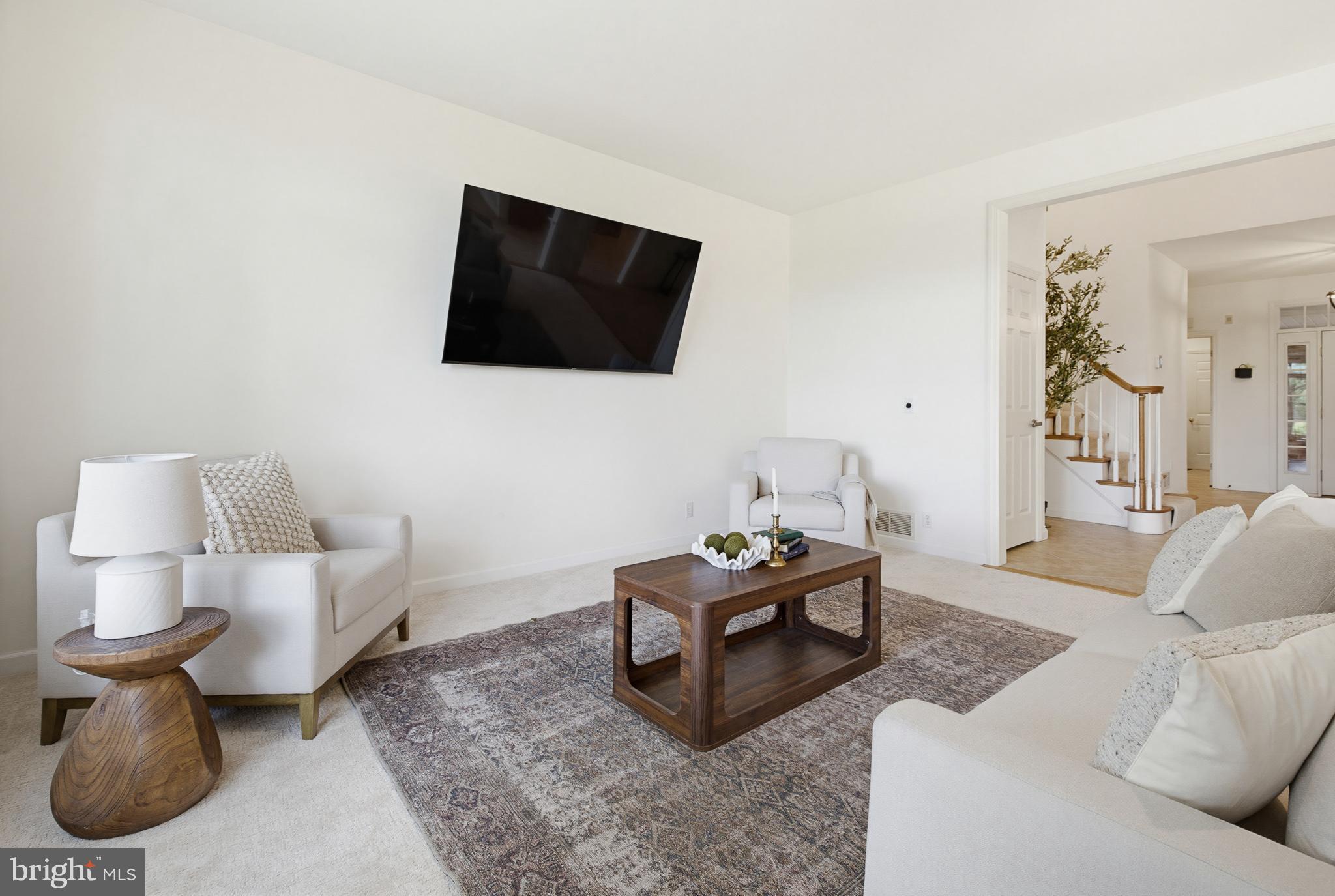 634 Northfield Road Lititz, PA 17543 - Photo 23 of 45 a living room with furniture and a flat screen tv
