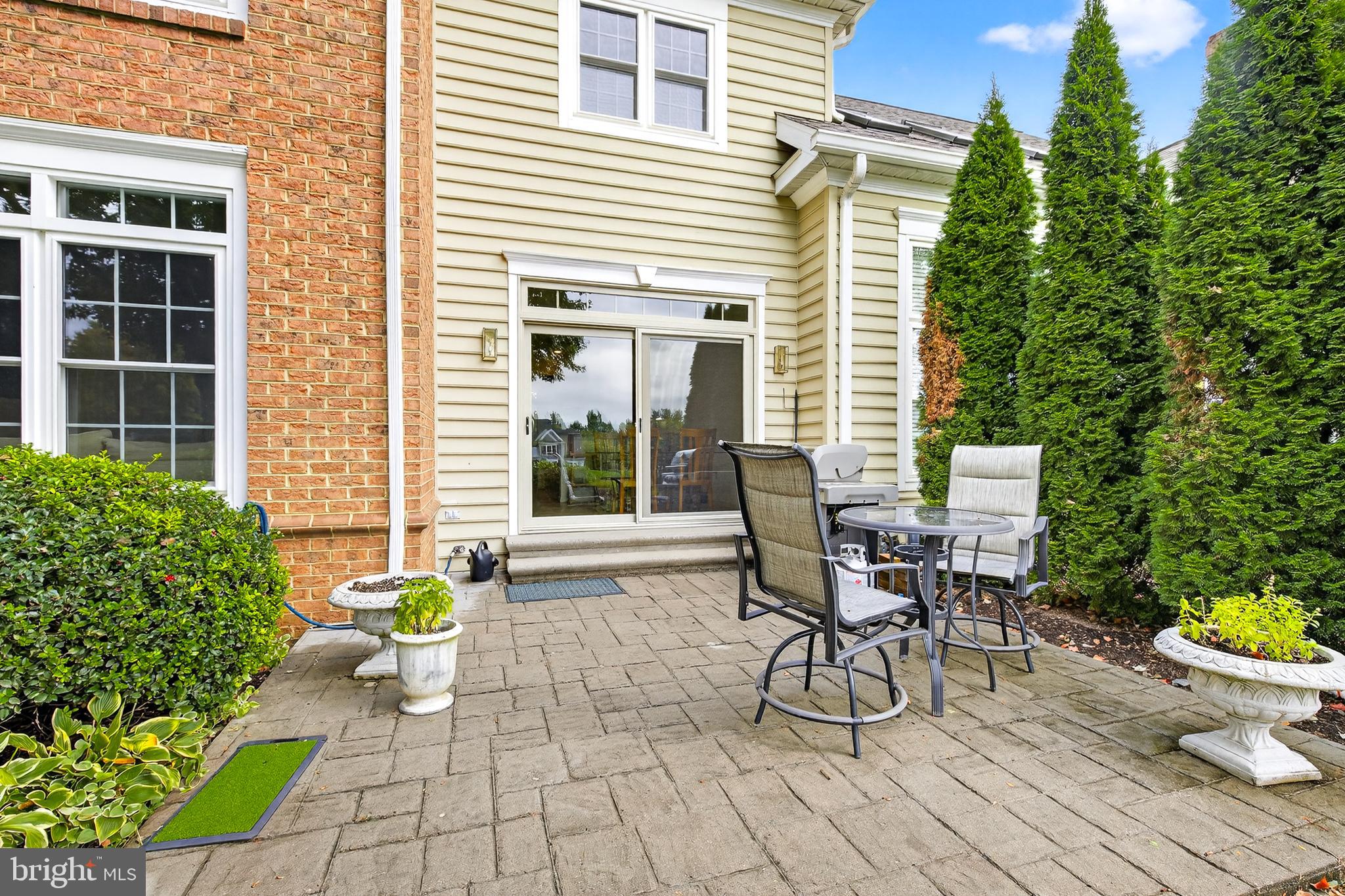 634 Northfield Road Lititz, PA 17543 - Photo 38 of 45 a view of a patio with table and chairs and potted plants