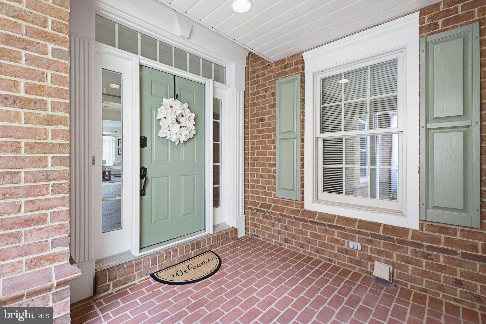 634 Northfield Road Lititz, PA 17543 - Photo 9 of 45 a view of a door with a bench and potted plant