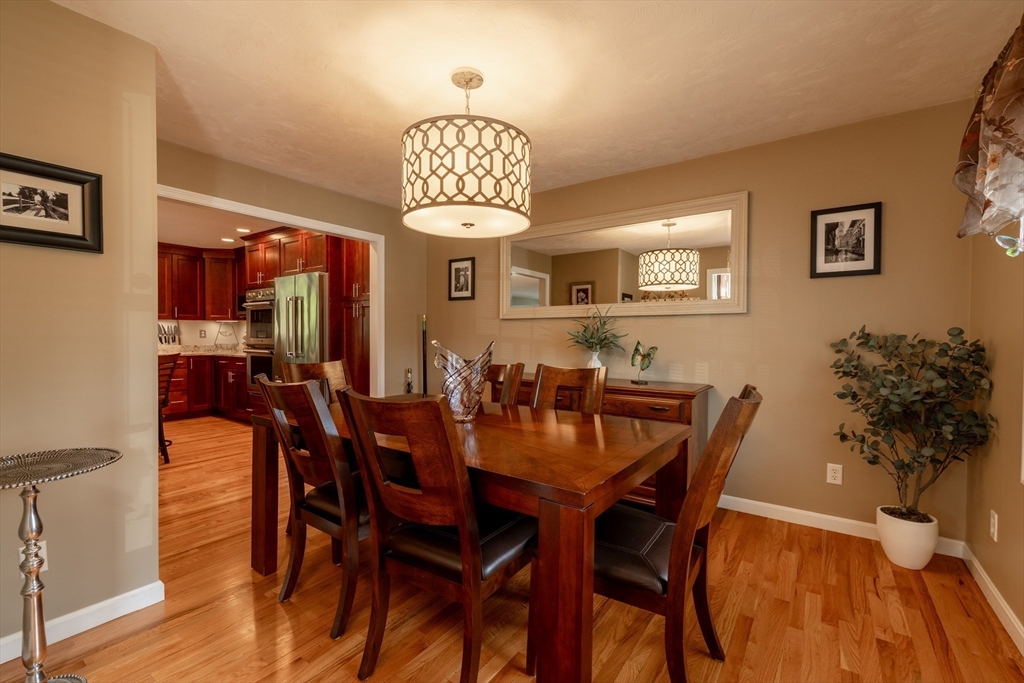 22 Duluth Street Worcester, MA 01604 - Photo 12 of 35 a view of a dining room with furniture wooden floor and chandelier
