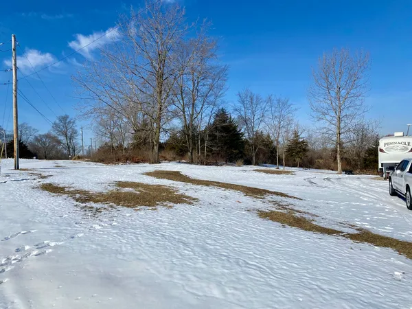 a view of side of snow with yard