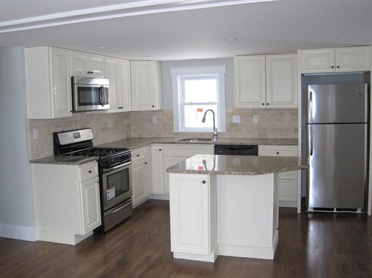 126 Old Town Road Hyannis, MA 02601 - Photo 2 of 13 a kitchen with a stove a sink and a refrigerator