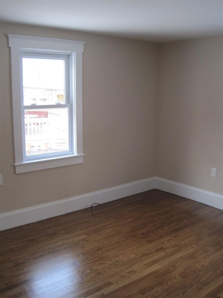 126 Old Town Road Hyannis, MA 02601 - Photo 5 of 13 a view of an empty room with wooden floor and a window