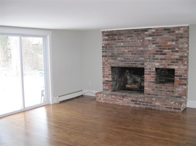 126 Old Town Road Hyannis, MA 02601 - Photo 6 of 13 a view of empty room with wooden floor and fireplace
