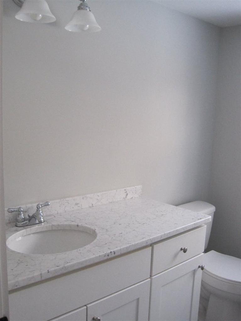 126 Old Town Road Hyannis, MA 02601 - Photo 9 of 13 a bathroom with a granite countertop sink and toilet